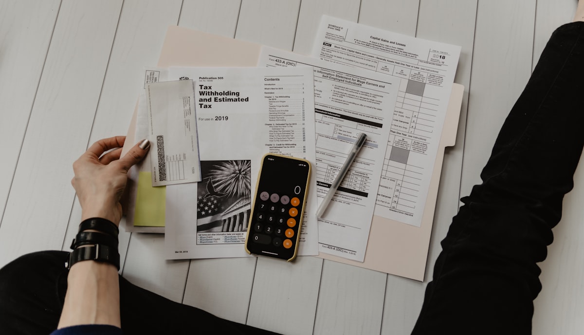 Close-up of a financial term sheet and calculator used to model incentive value