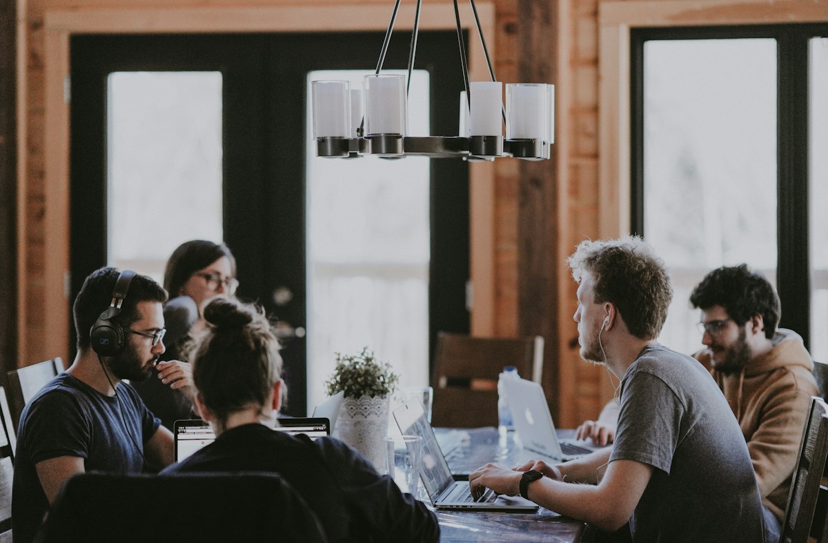 Business team meeting around a conference table during a market entry planning session